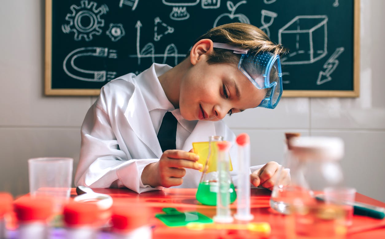 Boy playing with chemistry game