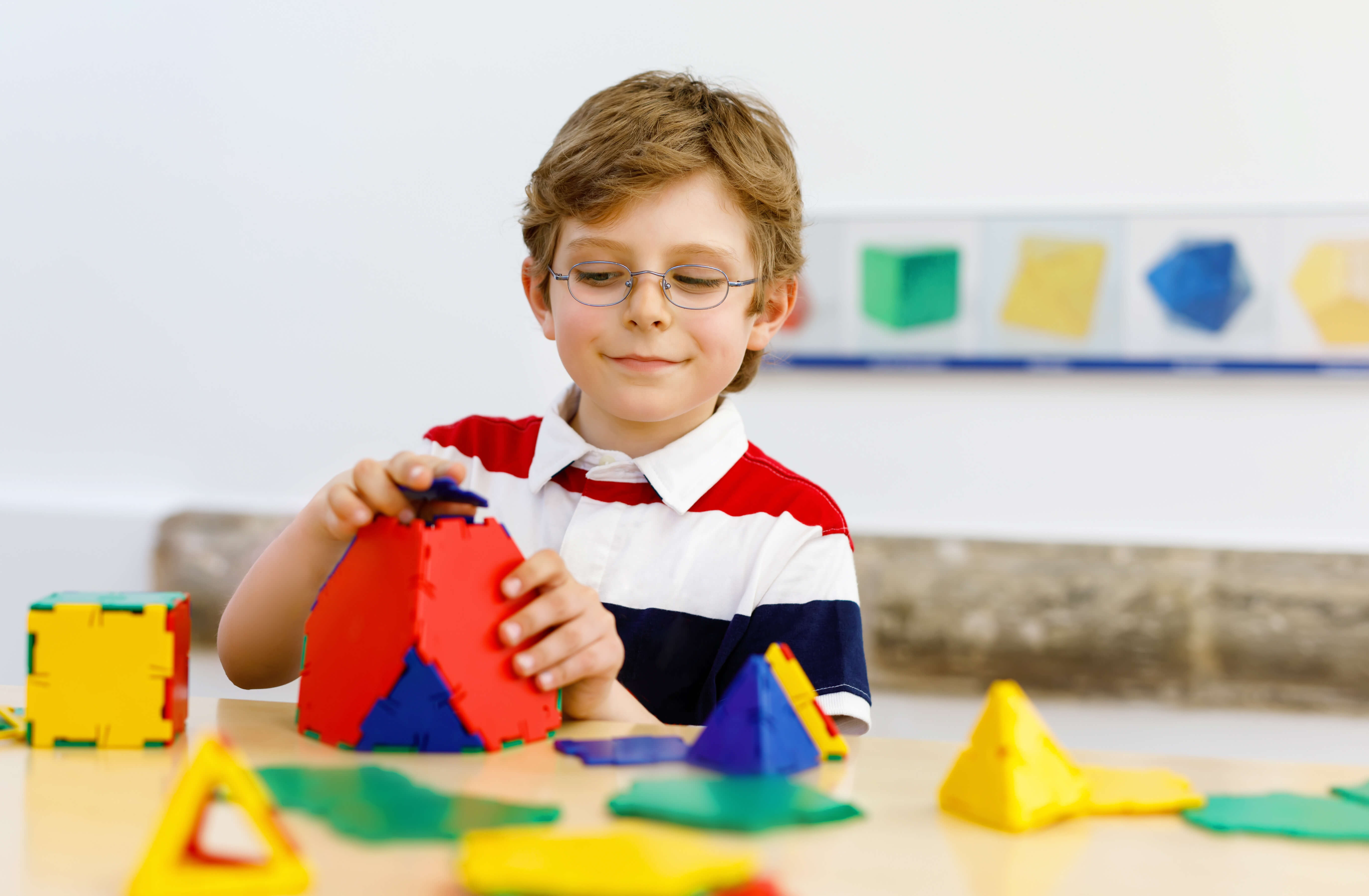 Student using pattern blocks in math class.