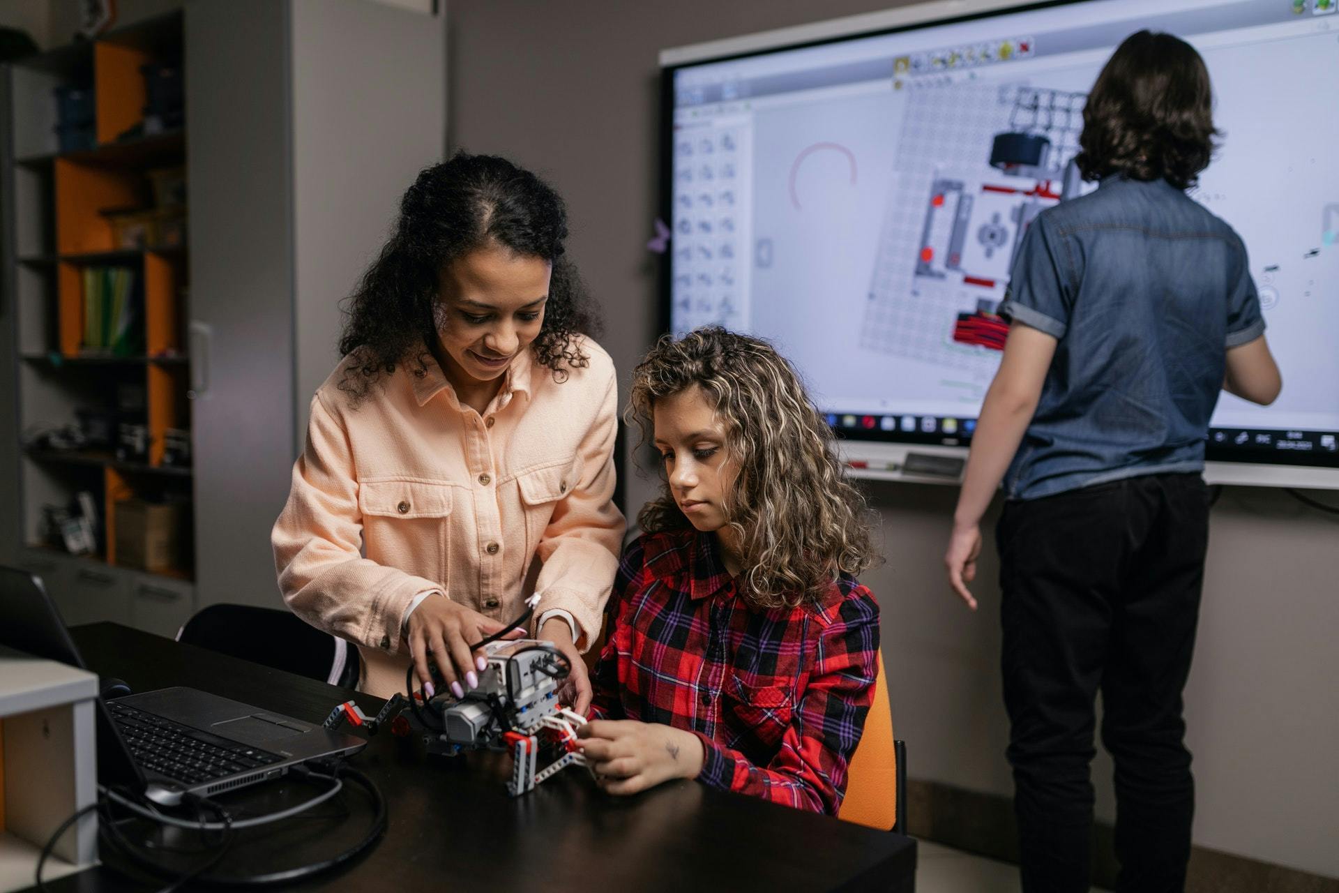 Three students work together on a problem-based learning exercise.